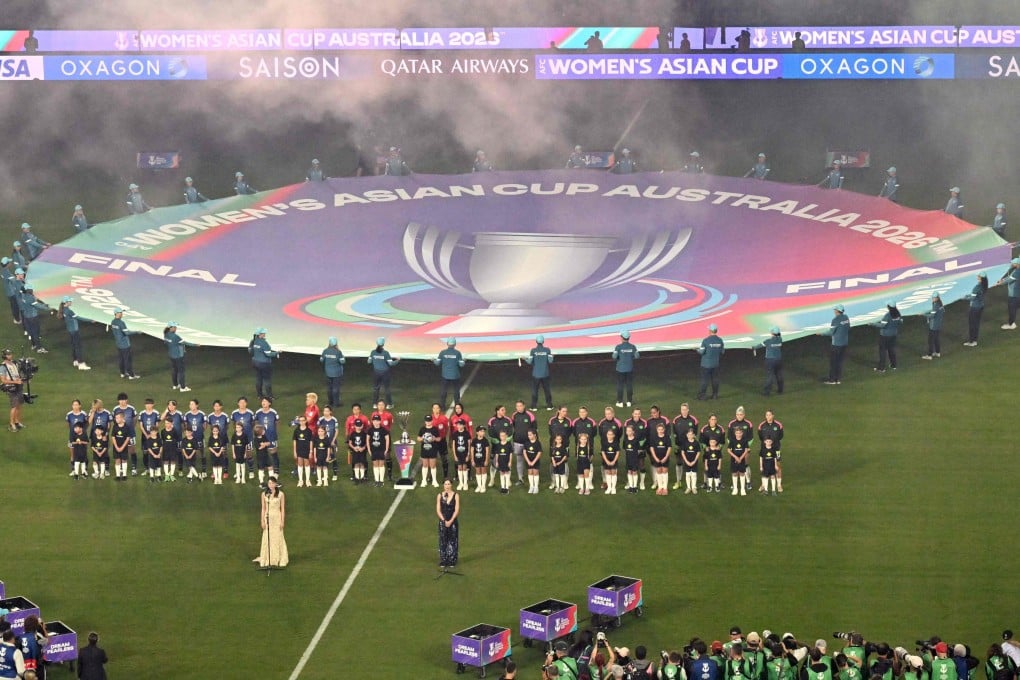 Australia and Japan stand for the national anthems before the final of the AFC Womens Asian Cup tournament last month. Photo: AFP