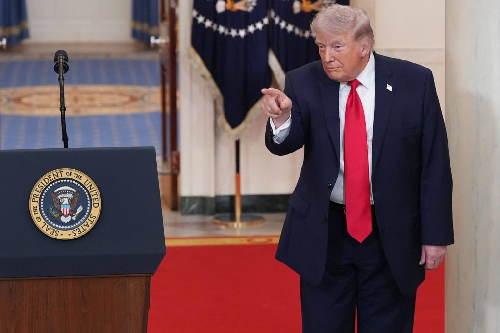 US President Donald Trump points after speaking in a televised address to the nation on the conflict in the Middle East from the Cross Hall of the White House in Washington on April 1. Photo: AFP