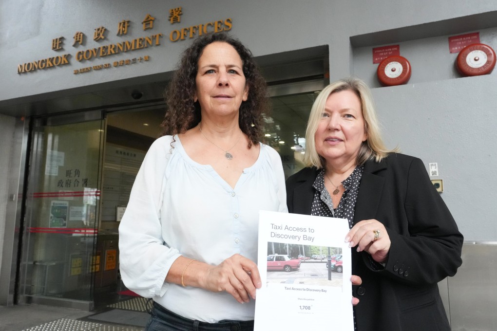 Dana Winograd (left) and fellow Discovery Bay resident Kate Wade pose with the petition at Mong Kok Government Offices. Photo: Jelly Tse