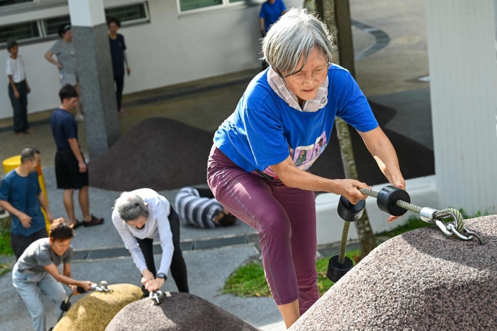 Singaporean seniors take part in a parkour training session, in which around 20 retirees learn to tackle a series of relatively demanding exercises, building their agility and enjoying a sense of camaraderie, on March 17, 2026. Photo: AFP