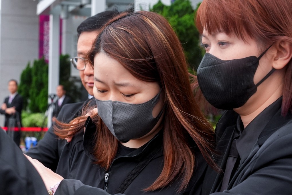 ISS property officer Cheng Tsz-ying (centre) leaves the hearing on Thursday. Photo: Elson Li
