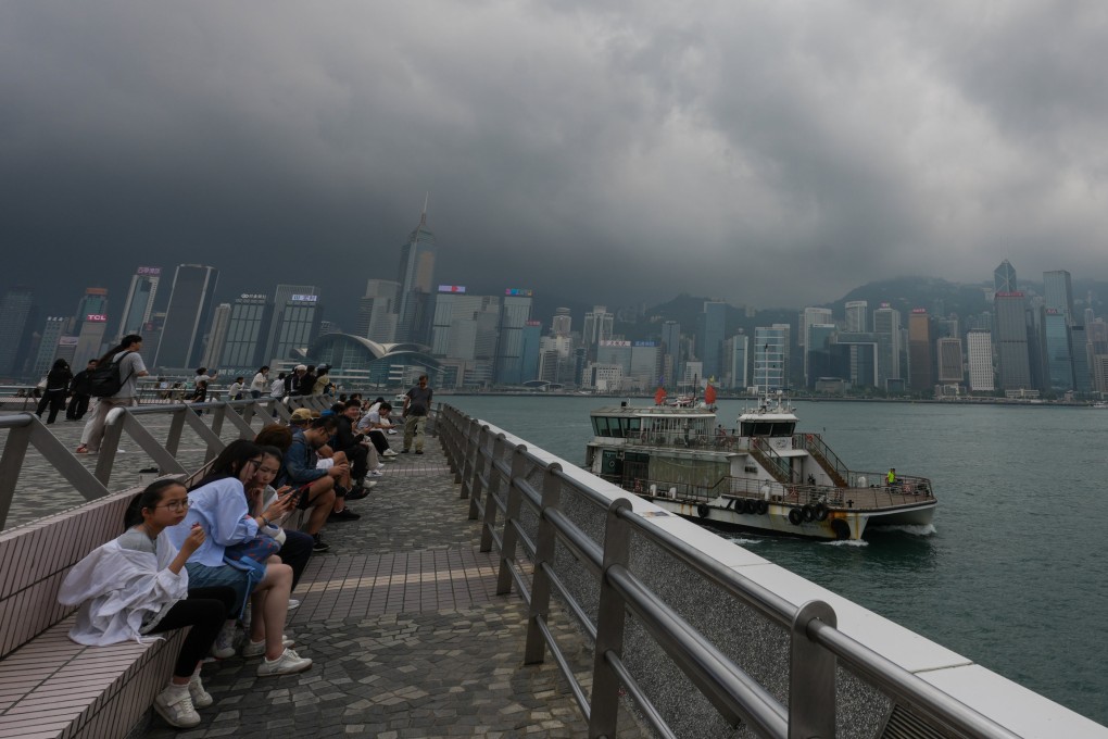 Tourists gather at the Tsim Sha Tsui waterfront despite the gloomy skies. Photo: Jelly Tse