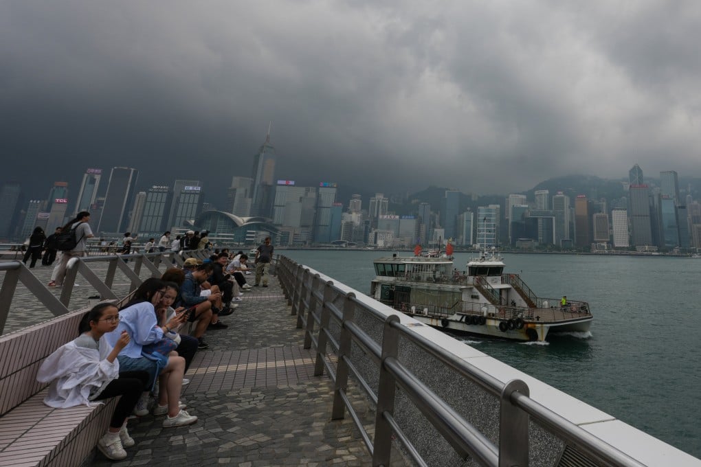 Tourists gather at the Tsim Sha Tsui waterfront despite the gloomy skies. Photo: Jelly Tse