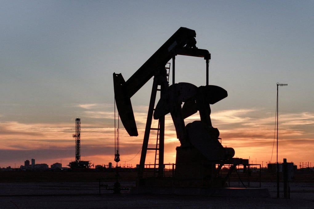 A pump jack and drilling rig in Texas. File photo: Reuters