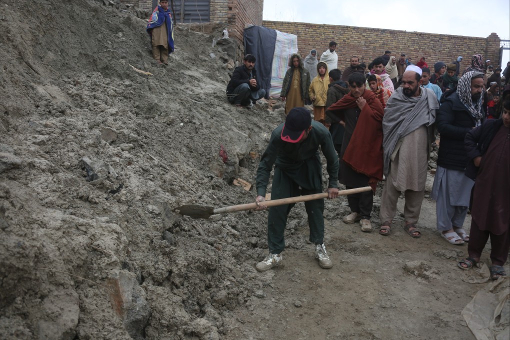 A man digs in the ruins of a building after a fatal earthquake in Kabul province, Afghanistan, on Saturday. Photo: Xinhua