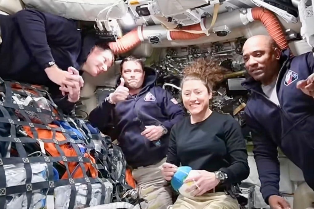 The Artemis II crew speak to Nasa Mission Control in a video conference while en route to the moon on Thursday. Photo: Nasa/AP