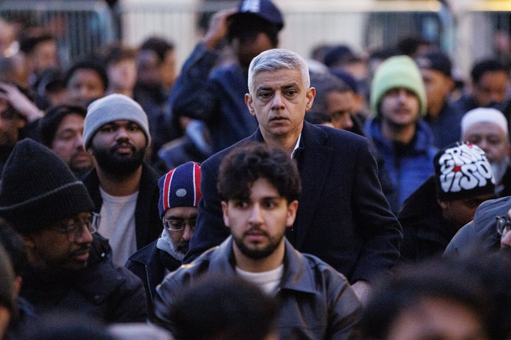 Mayor of London Sadiq Khan (centre) joins a prayer at a Ramadan dinner event at Trafalgar Square on March 16. Photo: EPA