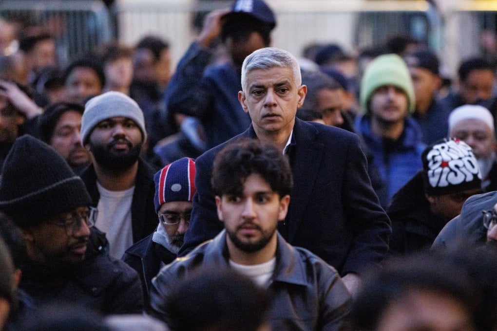 Mayor of London Sadiq Khan (centre) joins a prayer at a Ramadan dinner event at Trafalgar Square on March 16. Photo: EPA