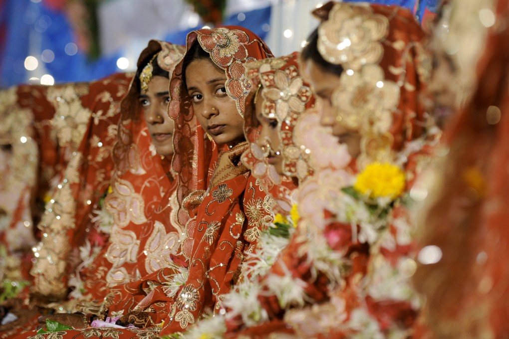 Brides sit during a mass marriage ceremony in Mumbai. Photo: AFP