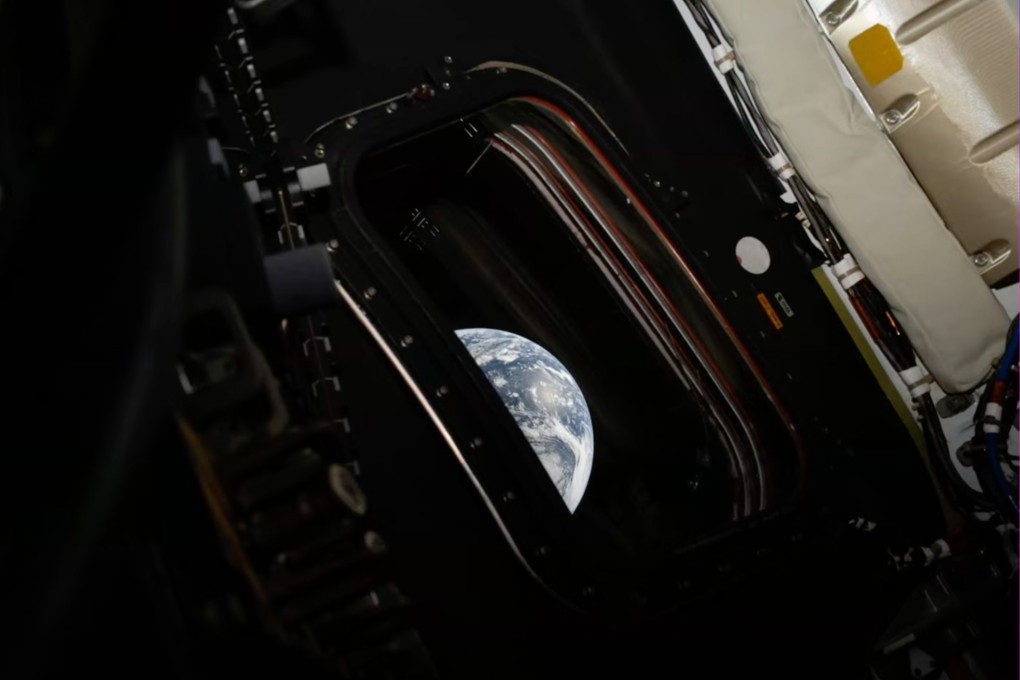 Earth is seen from inside the Orion capsule in an image released by Nasa on Friday.  Photo: Nasa via AP