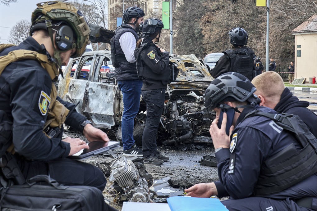 Ukrainian experts work at the site of a Russian drone strike on a residential area in Kharkiv, Ukraine, on Friday. Photo: EPA