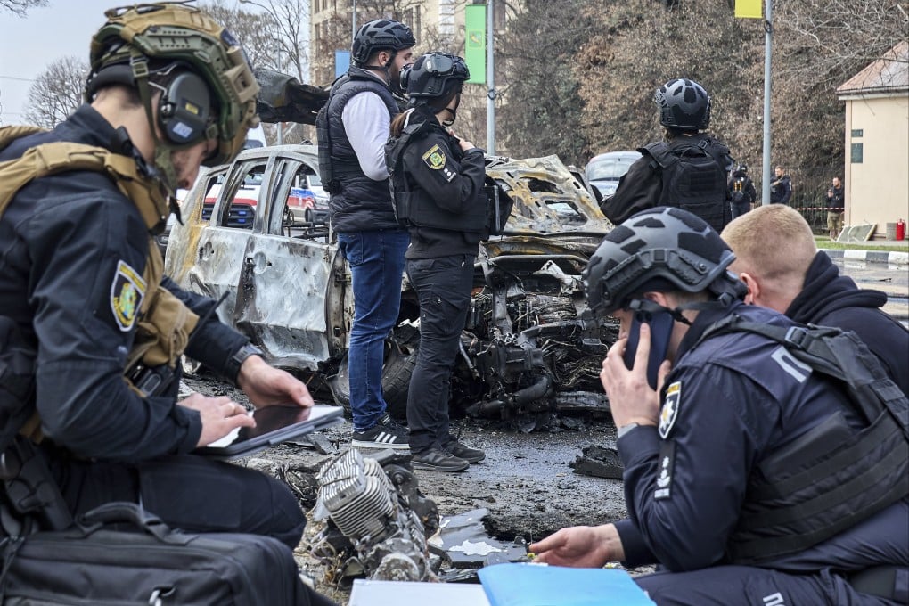 Ukrainian experts work at the site of a Russian drone strike on a residential area in Kharkiv, Ukraine, on Friday. Photo: EPA