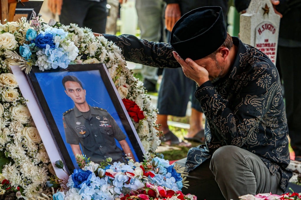 A relative reacts next to the grave of Zulmi Aditya Iskandar, a UN peacekeeper killed in Lebanon, after a funeral ceremony at Cikutra Heroes Cemetery in Bandung, West Java, Indonesia, on Sunday. Photo: Reuters