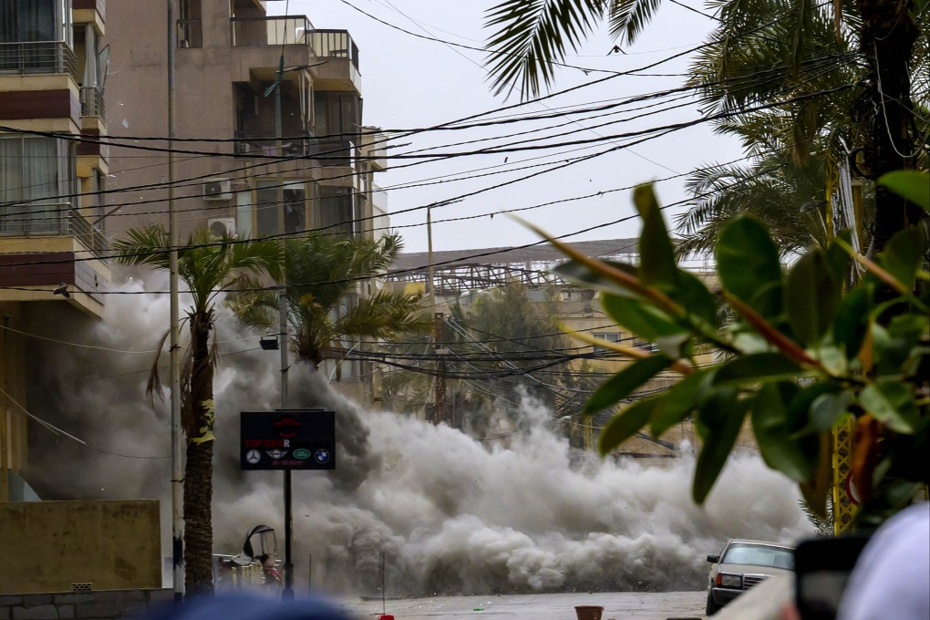 Smoke and dust from an Israeli airstrike on the streets of the southern suburbs of Beirut, Lebanon, on Sunday. Photo: Xinhua