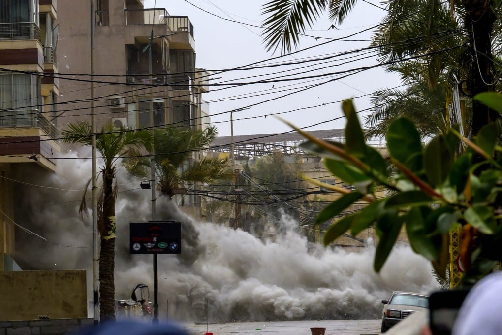 Smoke and dust from an Israeli airstrike on the streets of the southern suburbs of Beirut, Lebanon, on Sunday. Photo: Xinhua