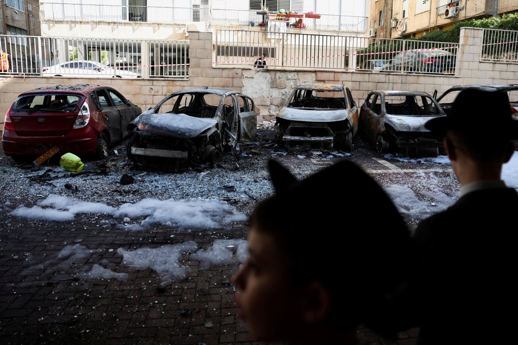Burnt-out vehicles in Petah Tikva, Israel, following a barrage of missiles launched from Iran. Photo: Reuters