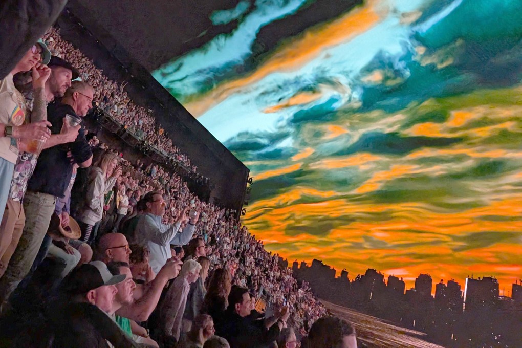 People at Las Vegas’ Sphere take in the 360-degree screen as they watch Dead & Company perform on March 22, 2025. Photo: TNS