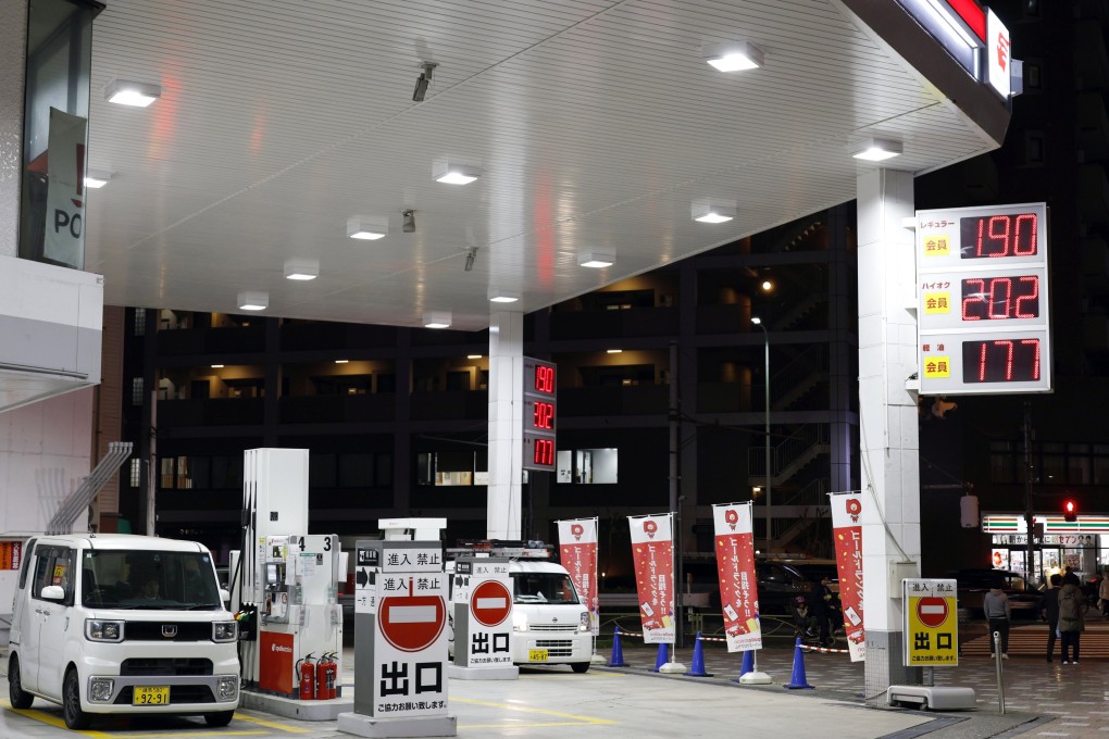 Fuel prices are displayed at a petrol station in Tokyo on March 18. Photo: EPA