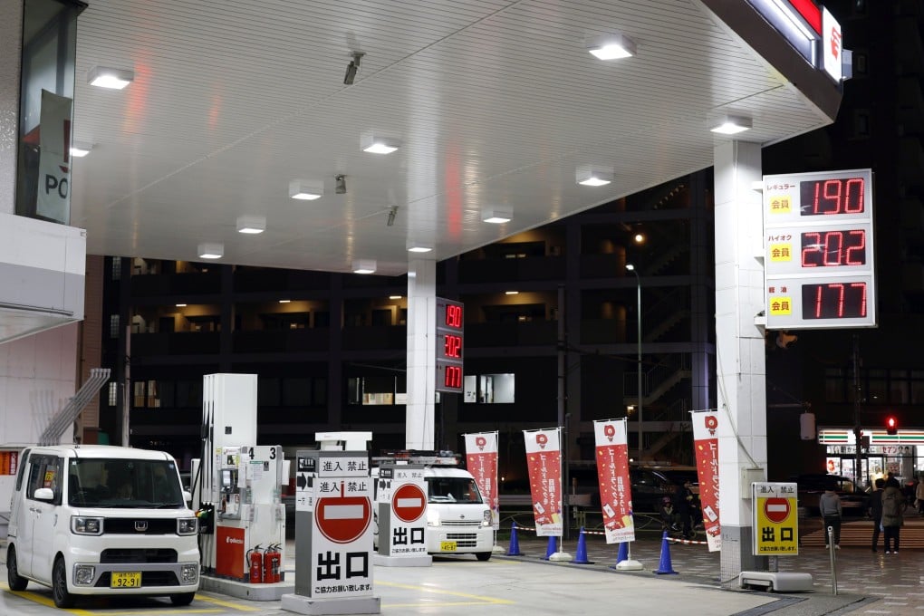 Fuel prices are displayed at a petrol station in Tokyo on March 18. Photo: EPA