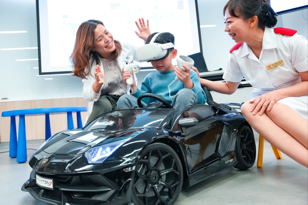 (From left) Anaethesiologist Dr Vansie Kwok, eight-year-old Aidan and operations manager Mok Yi Tan demonstrate the Hong Kong Children’s Hospital’s VR technology, designed to alleviate young patients’ pre-op anxiety. Photo: Jelly Tse