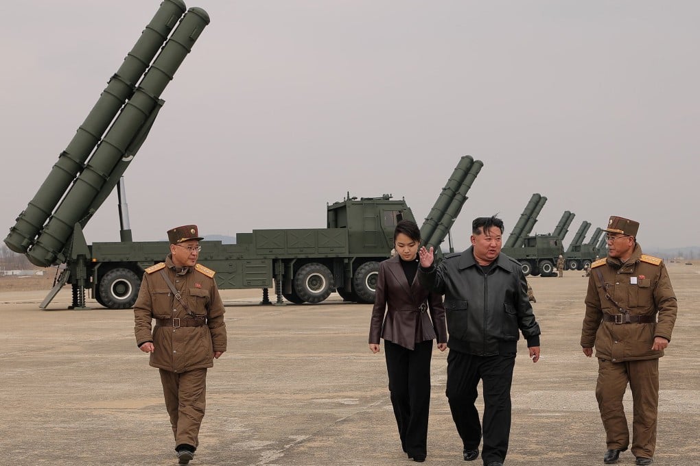 North Korean leader Kim Jong-un and daughter Ju Ae oversee the test-launch of 600 mm-calibre multiple rocket launchers on March 14. Photo: KCNA/Reuters