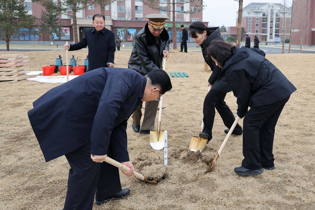 North Korean leader Kim Jong-un’s sister, Kim Yo-jong (second right) plants a tree in Pyongyang on March 14. Photo by KCNA/AFP