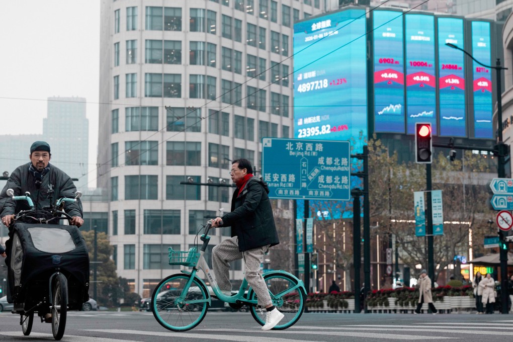 A huge screen displays the latest stock exchange and economic data in Shanghai. Photo: EPA