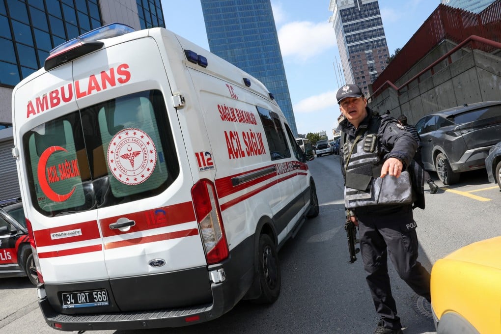 A police officer works at the scene, after gunfire was heard near the building housing the Israeli consulate in Istanbul, Turkey on Tuesday. Photo: Reuters