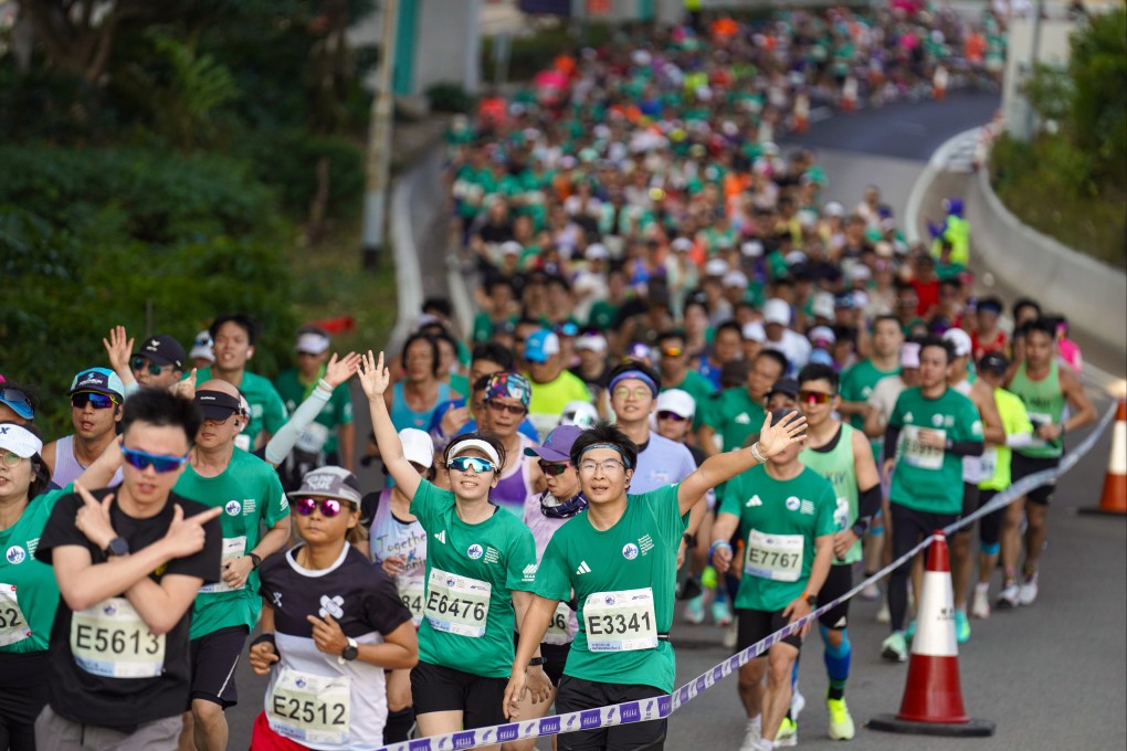 Runners make their way through Sheung Wan after passing through the Western Harbour Crossing during the 2026 Standard Chartered Hong Kong Marathon. Photo: Karma Lo