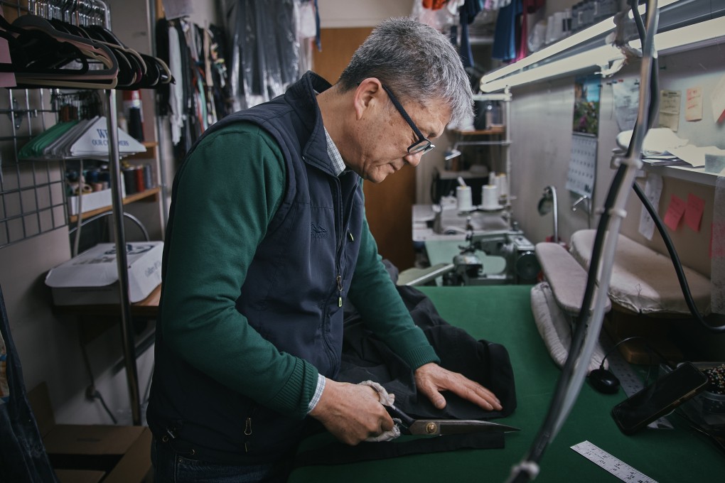 Tailor Kil Bae works on a garment at his shop in New York. He is part of a shrinking breed in the US, where sewers, dressmakers and tailors are ageing out of the workforce even as their services find new demand. Photo: AP