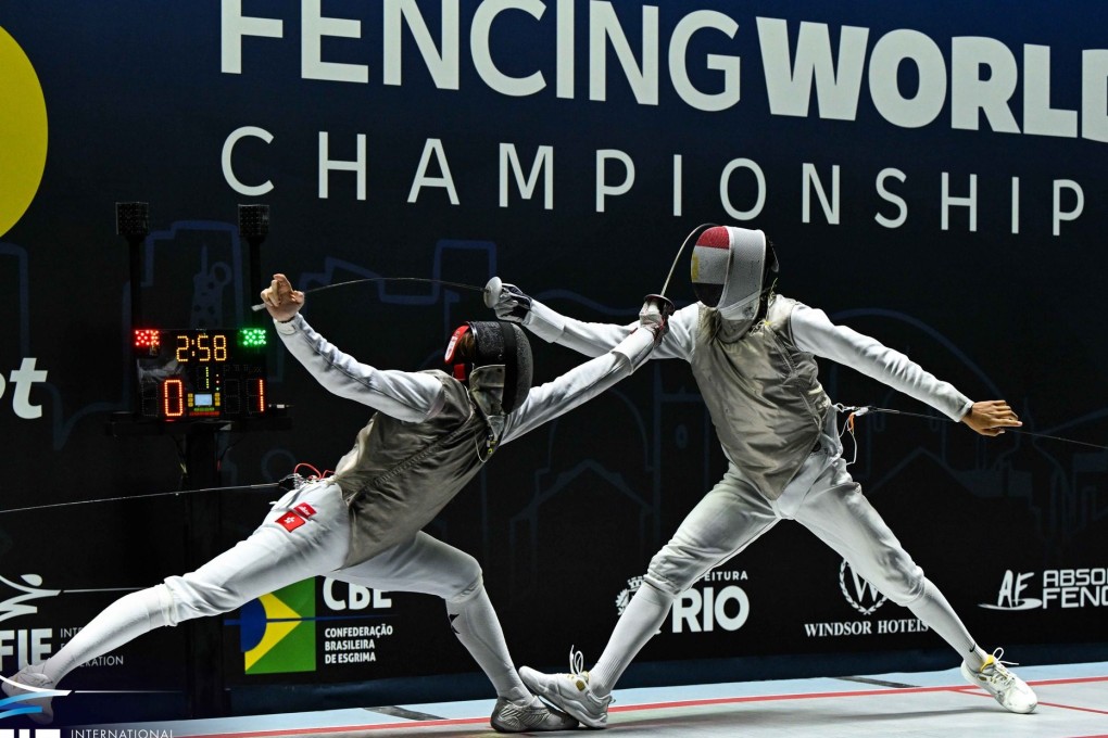 Hong Kong’s Lam Ho-long (left) beat Egypt’s Abdelrahman Tolba to win the men’s foil junior title on Sunday. Photo: International Fencing Federation (FIE)