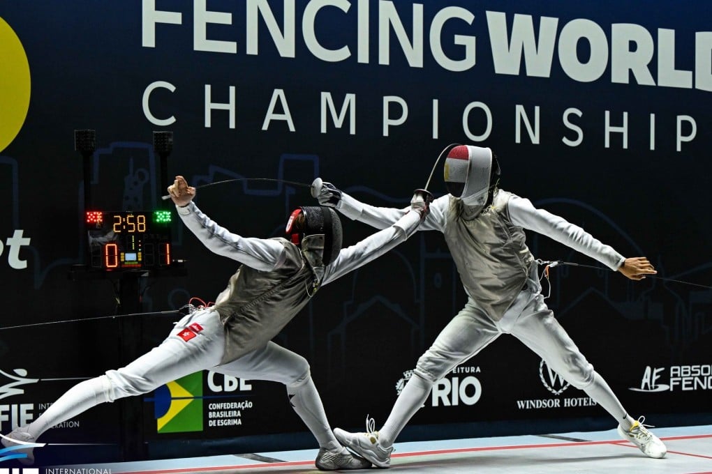 Hong Kong’s Lam Ho-long (left) beat Egypt’s Abdelrahman Tolba to win the men’s foil junior title on Sunday. Photo: International Fencing Federation (FIE)