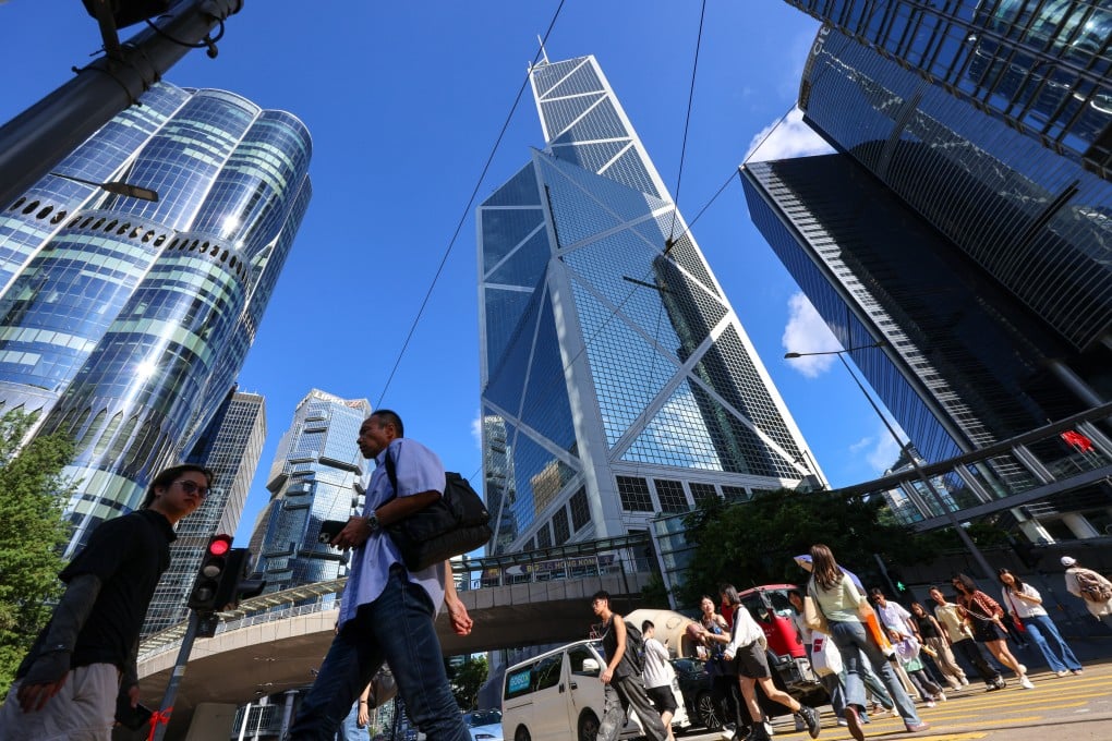 Residents cross the road in Central. Photo: Jelly Tse