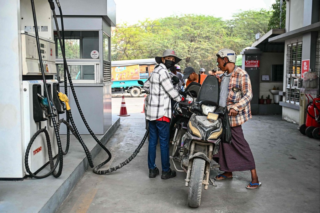 An employee refuels a vehicle at a petrol station amid rising prices in Mandalay, Myanmar, on March 20. Photo: AFP