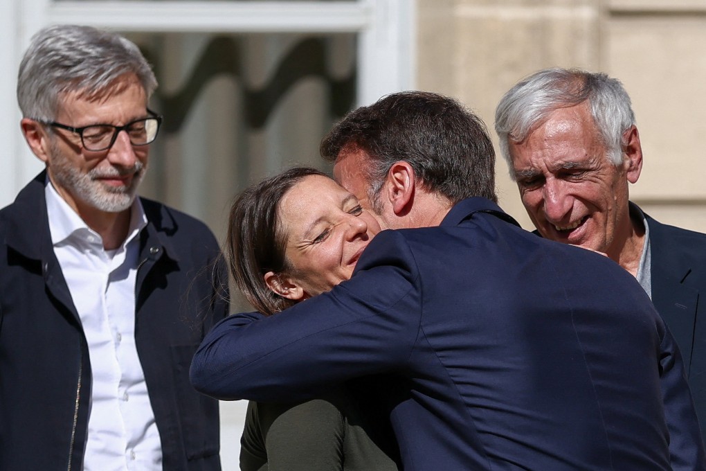 French President Emmanuel Macron greets Cecile Kohler and Jacques Paris after three and a half years in detention, next to French ambassador to Iran Pierre Cochard at the Elysee Palace in Paris on Wednesday. Photo: EPA
