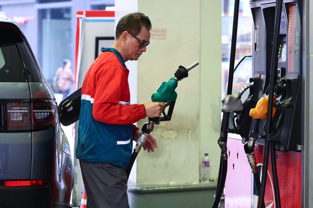 A customer uses a fuel pump at a Hong Kong petrol station. Photo: Dickson Lee