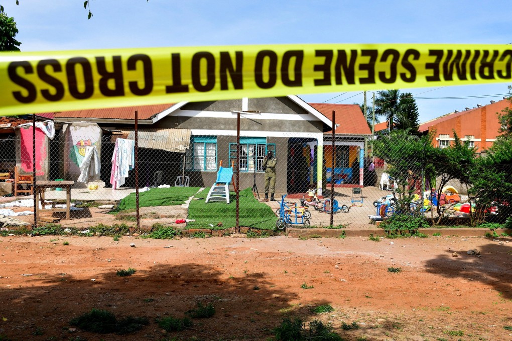 Police tape is seen at the scene of a stabbing attack at a kindergarten in Kampala, Uganda, on April 2. Photo: Reuters