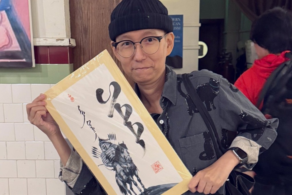 An August 2025 post on nasopharyngeal cancer patient Pitt Cheung’s Instagram account shows him holding a placard bearing a blessing written in Mongolian. Photo: Instagram/pittcheung