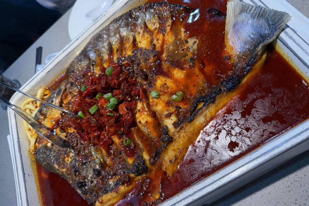 A whole simmered fish is served at Bantianyao Kaoyu, a Chinese restaurant in the Myeongdong area of central Seoul. Dishes like spicy hotpot and candied fruits that went viral in South Korea in the 2010s introduced young people to powerful Chinese flavours, which has grown into an established love of Chinese cuisine for many in the country. Photo: The Korea Times