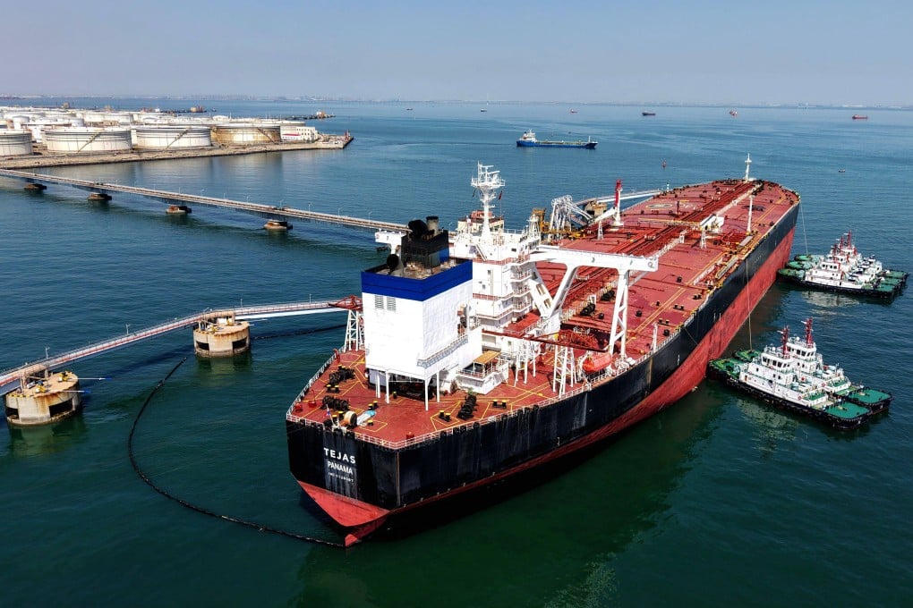 An oil tanker unloads crude oil at the port in Qingdao, in eastern Shandong province, on April 7. Photo: AFP