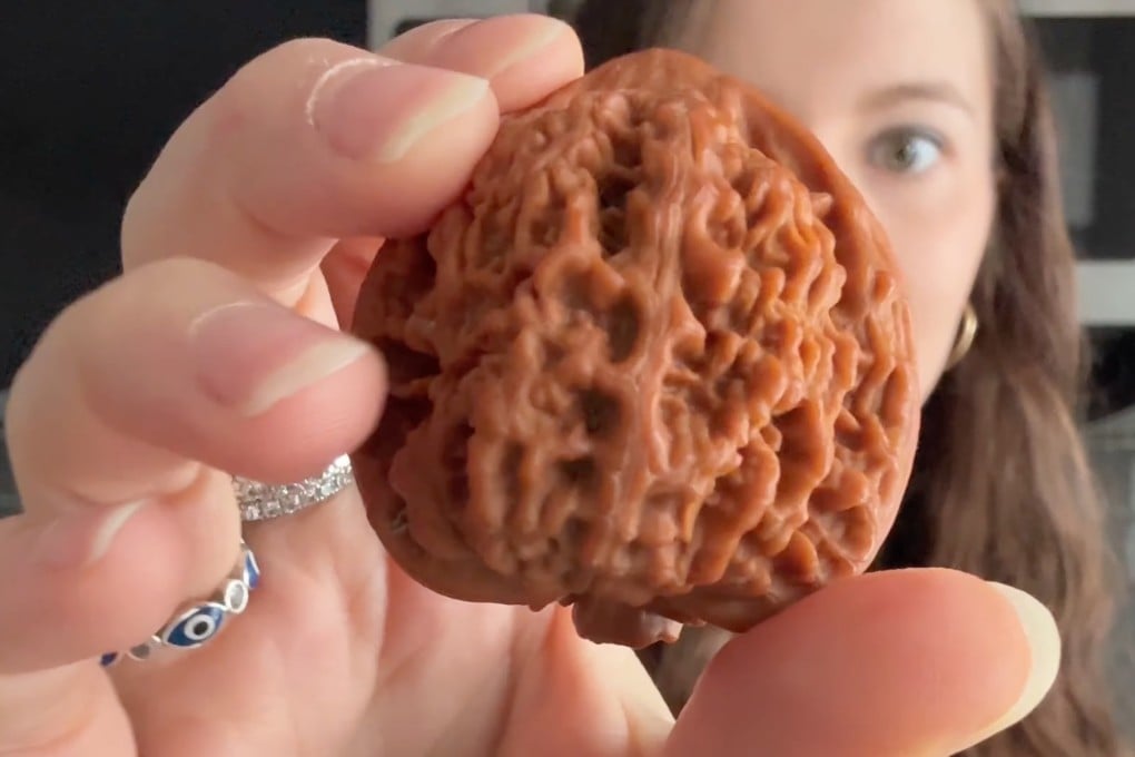 A social media trend takes on an ancient Chinese tradition in the form of rolling a pair of walnuts around in your hand until they turn into “jade”. Photo: YouTube/ growithjessie