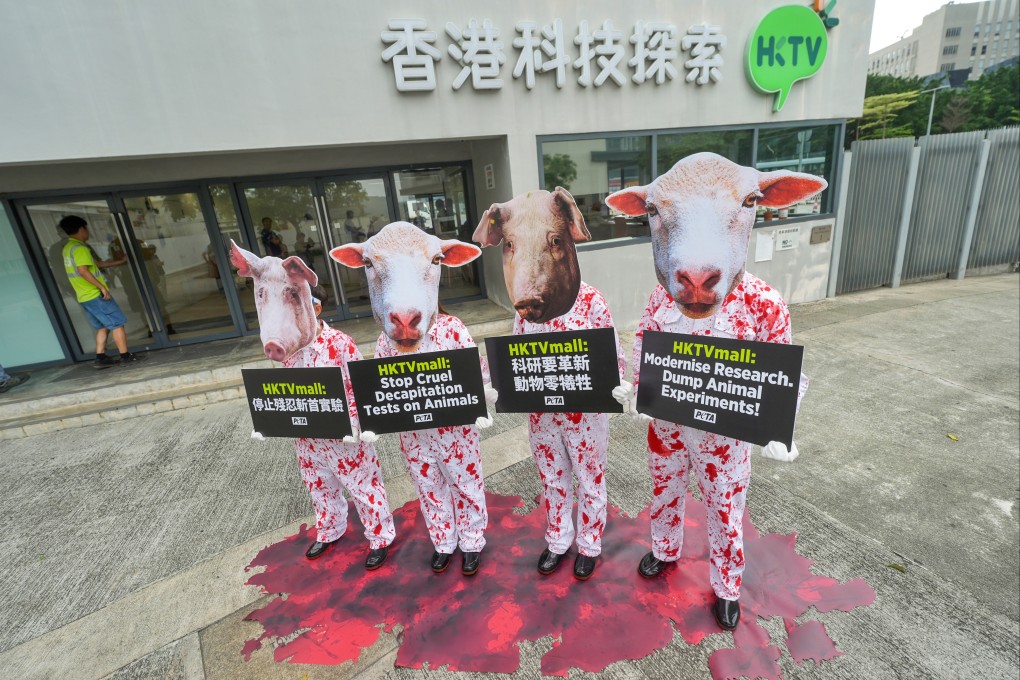 Animal rights advocates wearing pig and sheep masks stage a protest outside the HKTVmall building in Tseung Kwan O. Photo: Elson Li