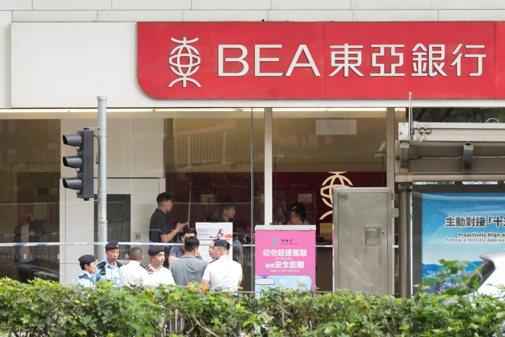 Police at the Bank of East Asia branch in Wan Chai that was robbed on Friday. Photo: Jelly Tse