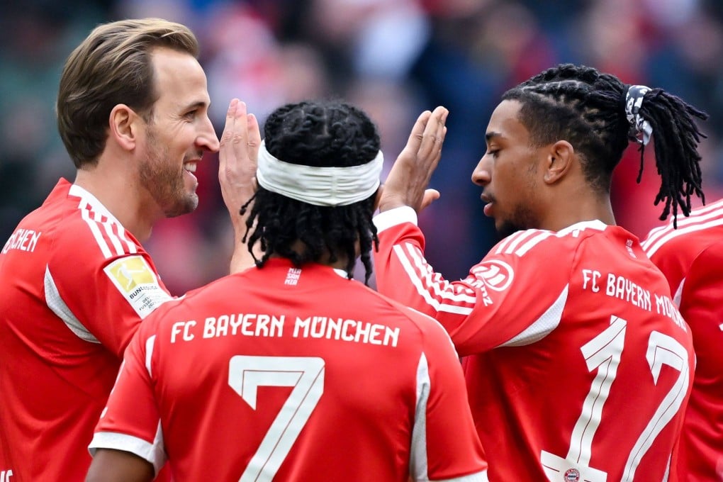 England captain Harry Kane (left) celebrates a goal with Bayern Munich teammates Serge Gnabry (centre) and Michael Olise. Photo: dpa