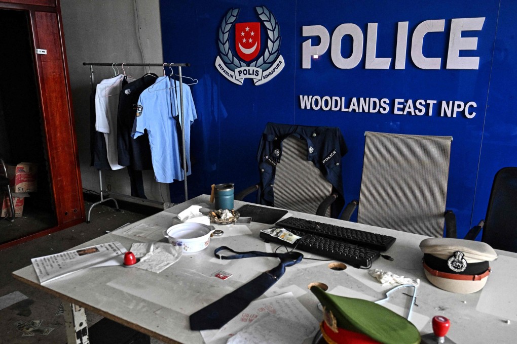 A fake Singapore police station is seen inside an abandoned scam centre in O’Smach town on the Thai-Cambodian border on March 12. Photo: AFP