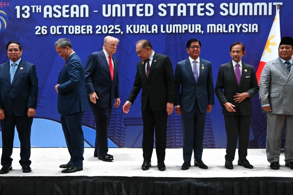 US President Donald Trump (centre) stands for a group photo with Southeast Asian leaders at the 13th Asean-United States Summit in Kuala Lumpur on October 26, 2025. Photo: AFP