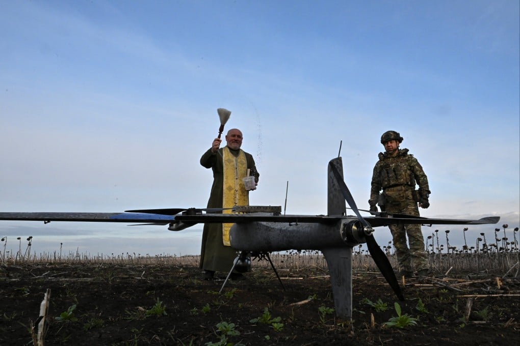 An Orthodox chaplain sprinkles holy water on a Gara combat drone in Zaporizhzhia region, Ukraine, on Wednesday. Photo: Reuters