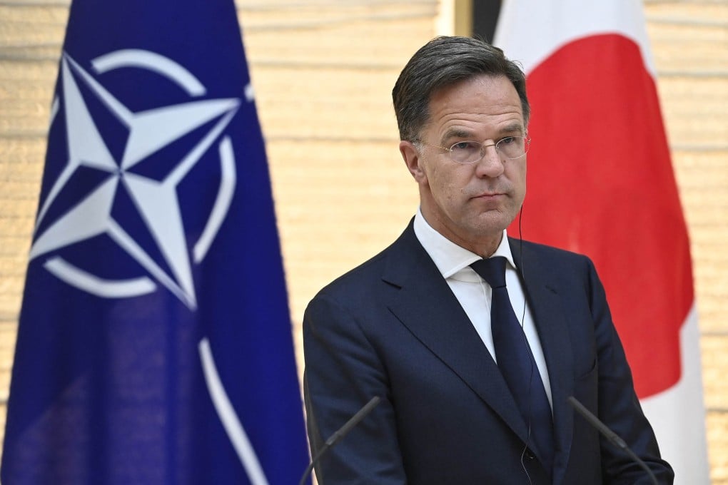 Nato Secretary General Mark Rutte stands in front of Japanese and Nato flags during a visit to Tokyo in April last year. Photo: AFP