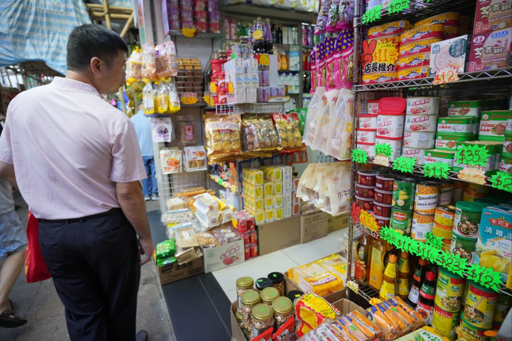 Customers buy food at a shop in Sham Shui Po. Photo: May Tse