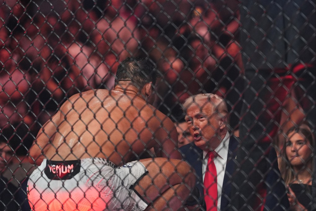 Paulo Costa talks to US President Donald Trump after he won his UFC fight in Miami on Saturday. Photo: AP